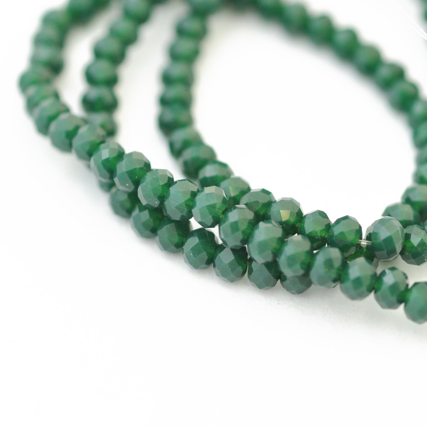 Briolette strand / dark green opaque / Ø 3 mm
