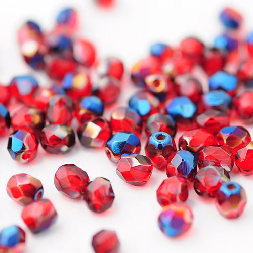 Preciosa Glasschliffperlen rot metallic blue / 100 Stk. / 4mm