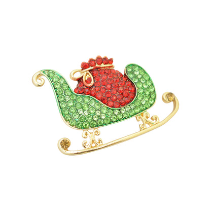 Christmas brooch sleigh rhinestones / gold colored / 30x45mm