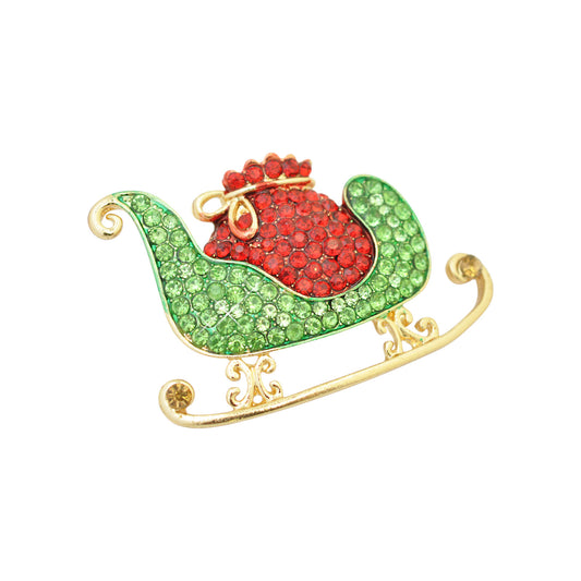 Christmas brooch sleigh rhinestones / gold colored / 30x45mm