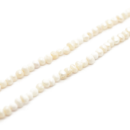 Strand of freshwater pearls irregular / cream / 3-4mm / 36cm