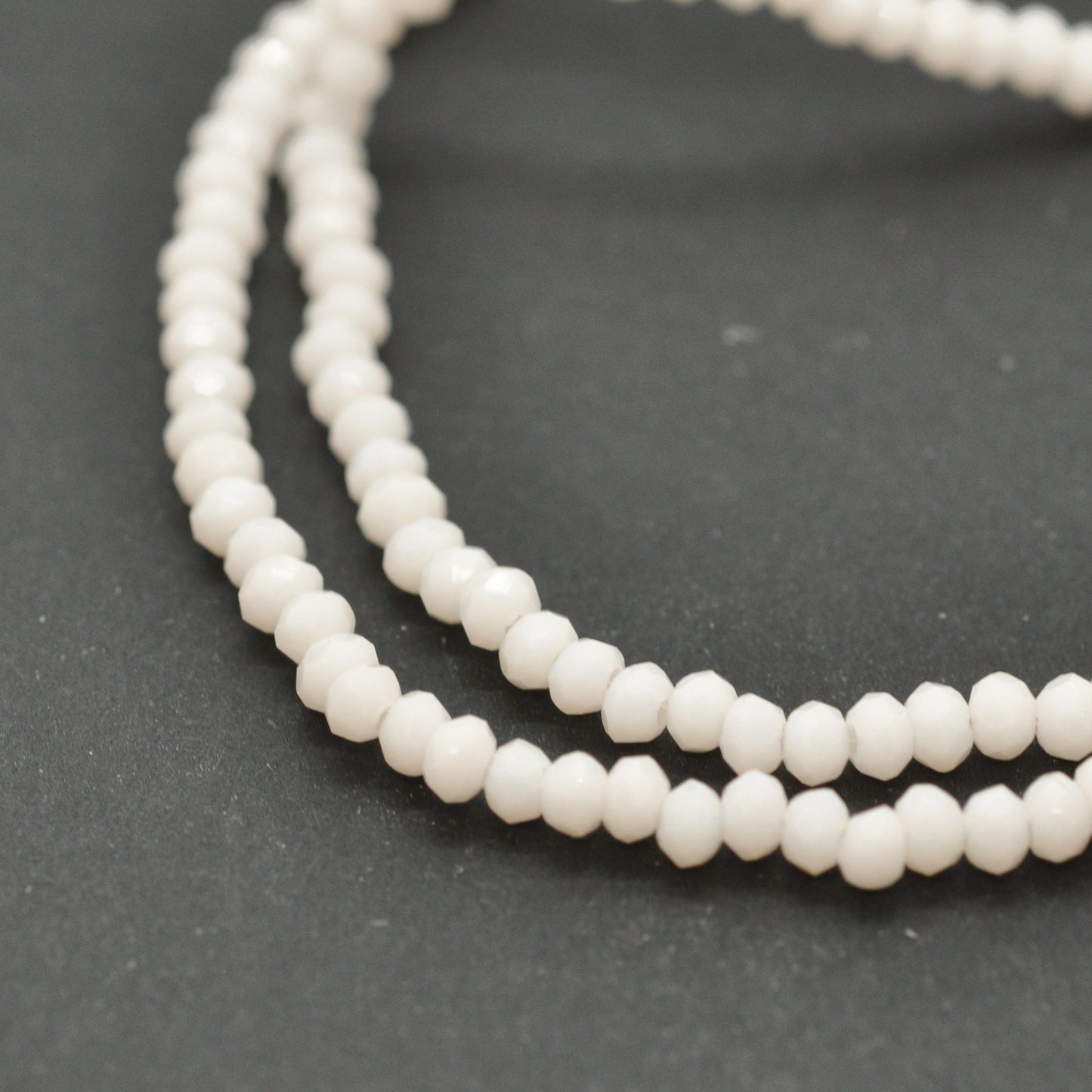 Briolette Strang /kristall briolet beige / 2mm