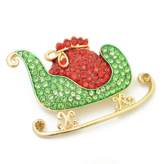 Weihnachtsbrosche Schlitten Strass  / goldfarben / 30x45mm