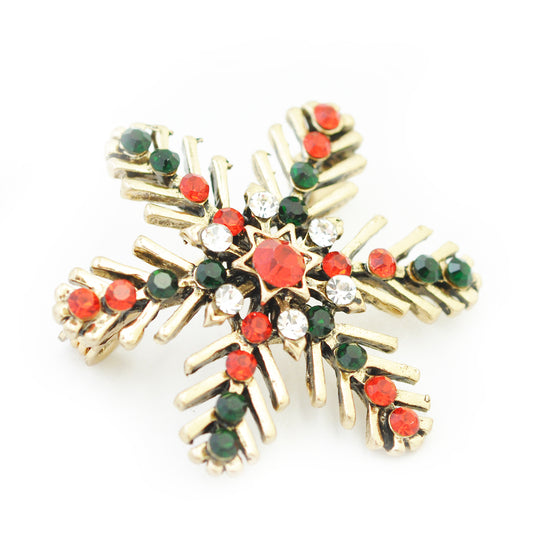 Weihnachtsbrosche Schneeflocke  / goldfarben / 35x35mm