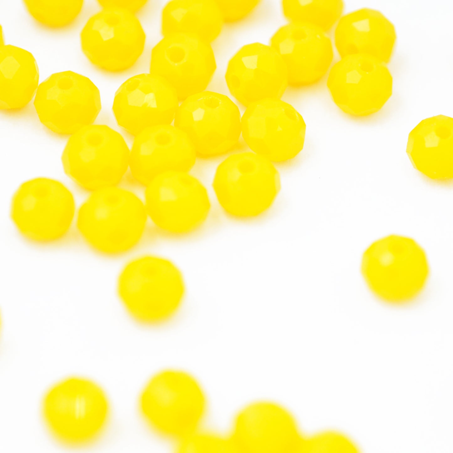 Briolette faceted yellow / 6mm