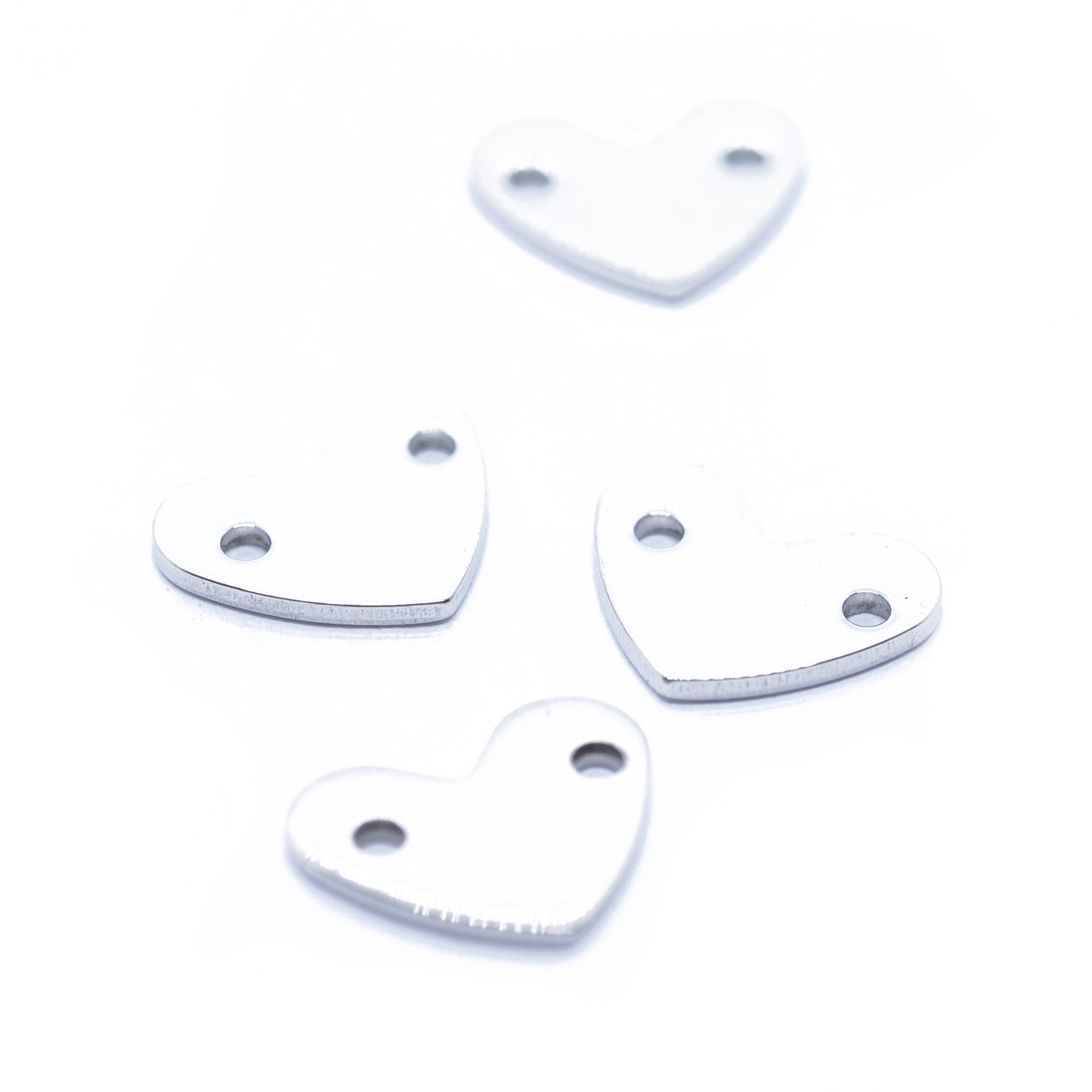 Stainless steel heart double hole / silver colored / Ø 14 mm