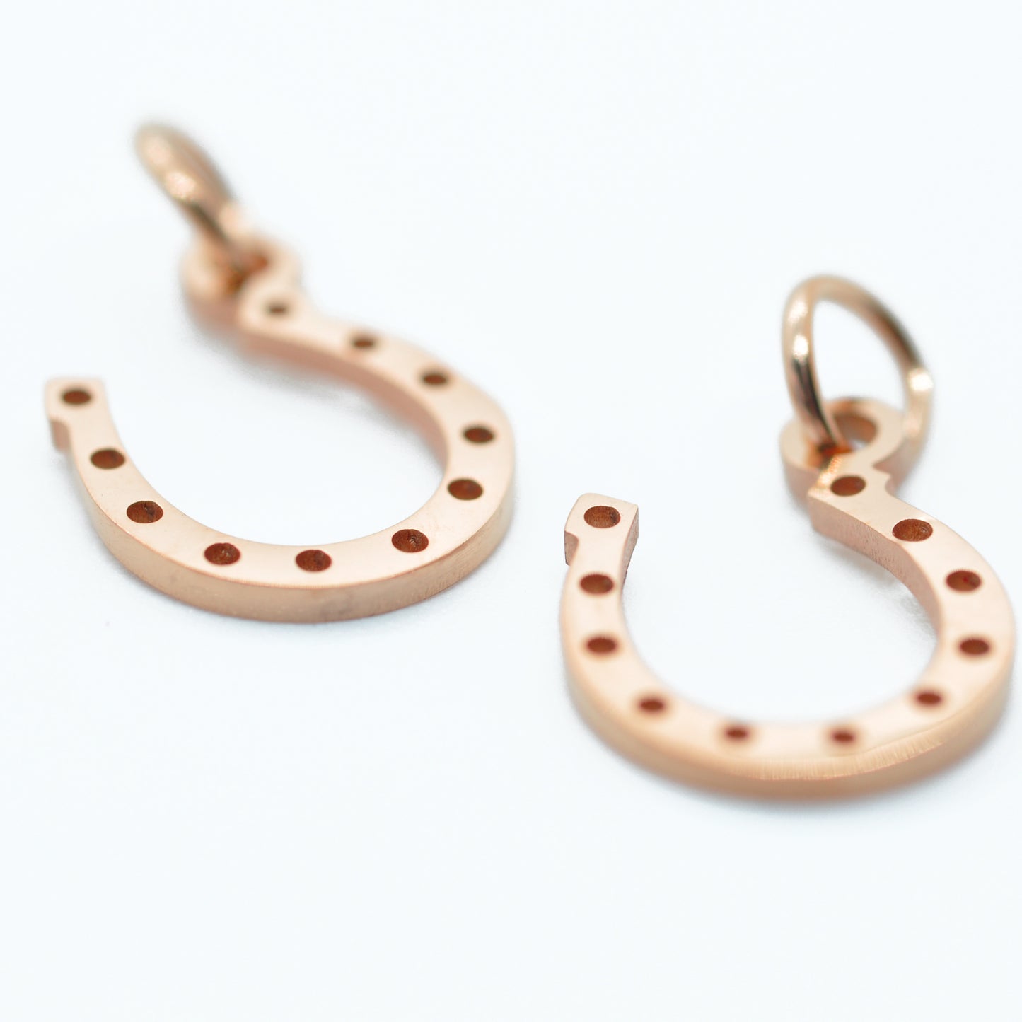 Horseshoe stainless steel pendant / rose gold plated / 12 mm