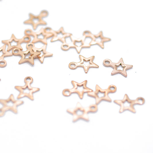 Stainless steel mini star pendant / rose gold plated / 7mm