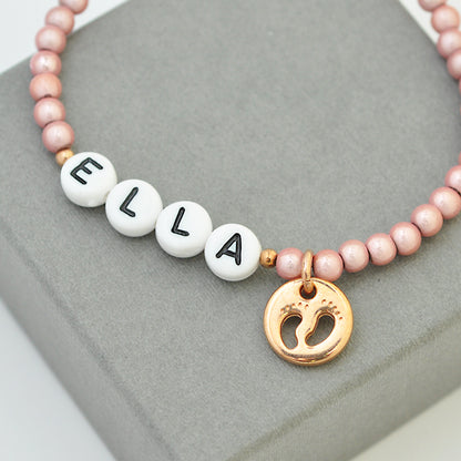 Children / baby bracelet with little feet pendant