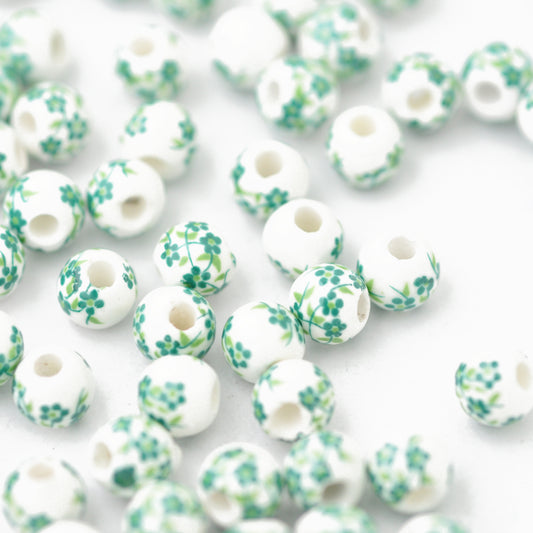 Porcelain bead flower green / Ø 6 mm