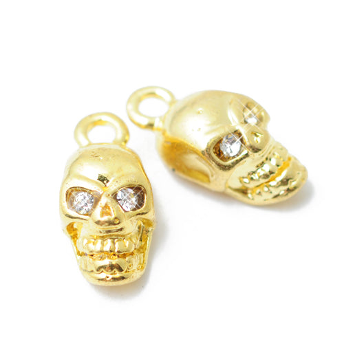 Skull pendant with rhinestone eyes / gold colored / 12 mm