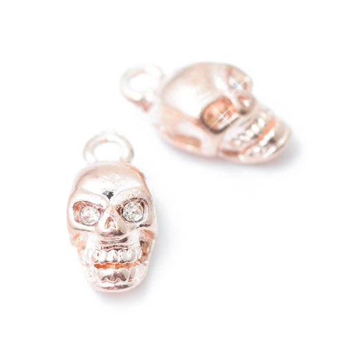 Skull pendant with rhinestone eyes / rose gold colored / 12 mm