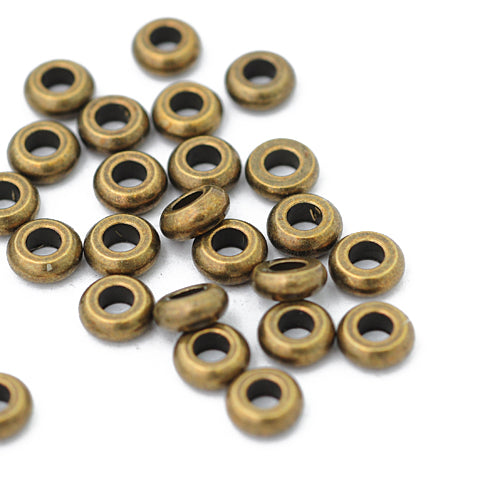 Spacer intermediate part / brass colored / Ø 7 mm